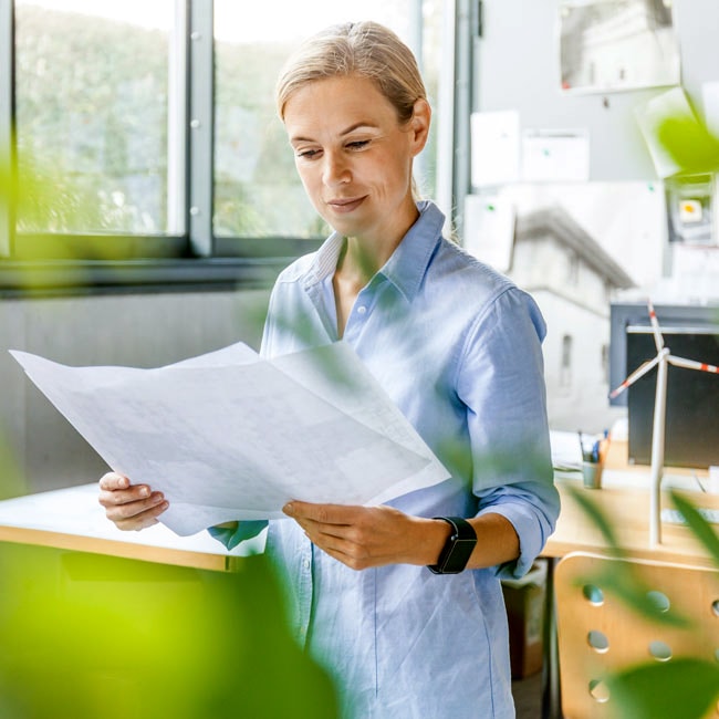 Woman studies floor plans